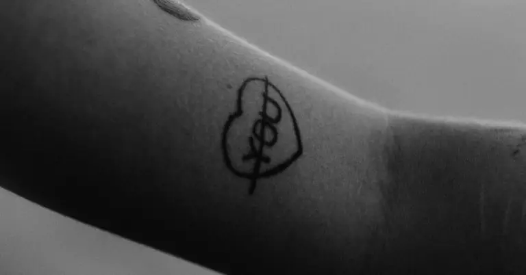 A crossed out love you tattoo from the post This is why you shouldn't get back with your ex.