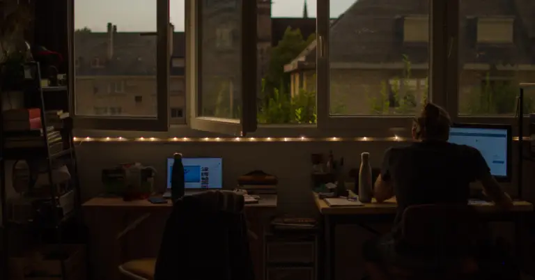 A man sat at a computer from the post Ever thought about going self-employed?