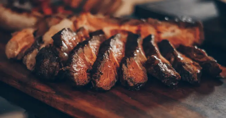 A steak on a chopping board from the post Mastering the Carnivore Diet: A Guide to Peak Performance through Meat-Based Nutrition